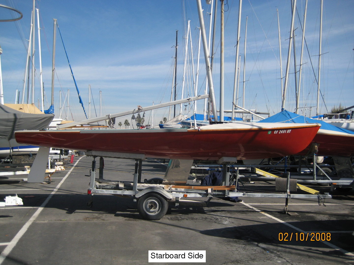 A red boat is parked in the dock.