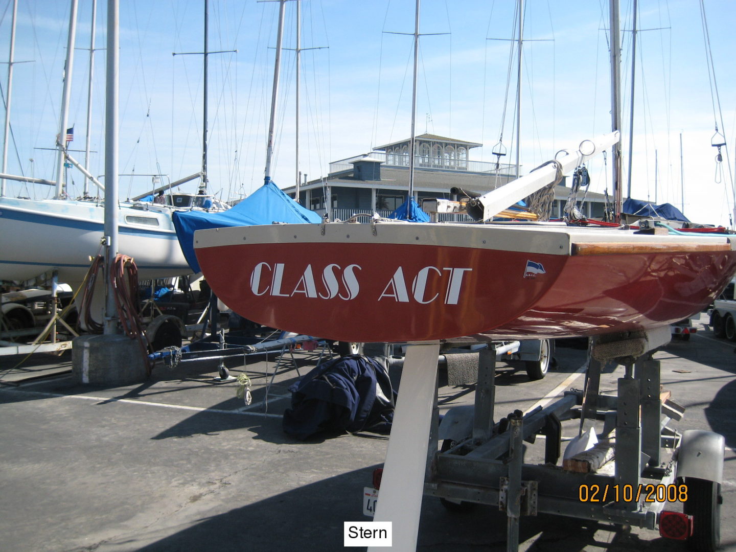 A red boat sitting on top of the water.