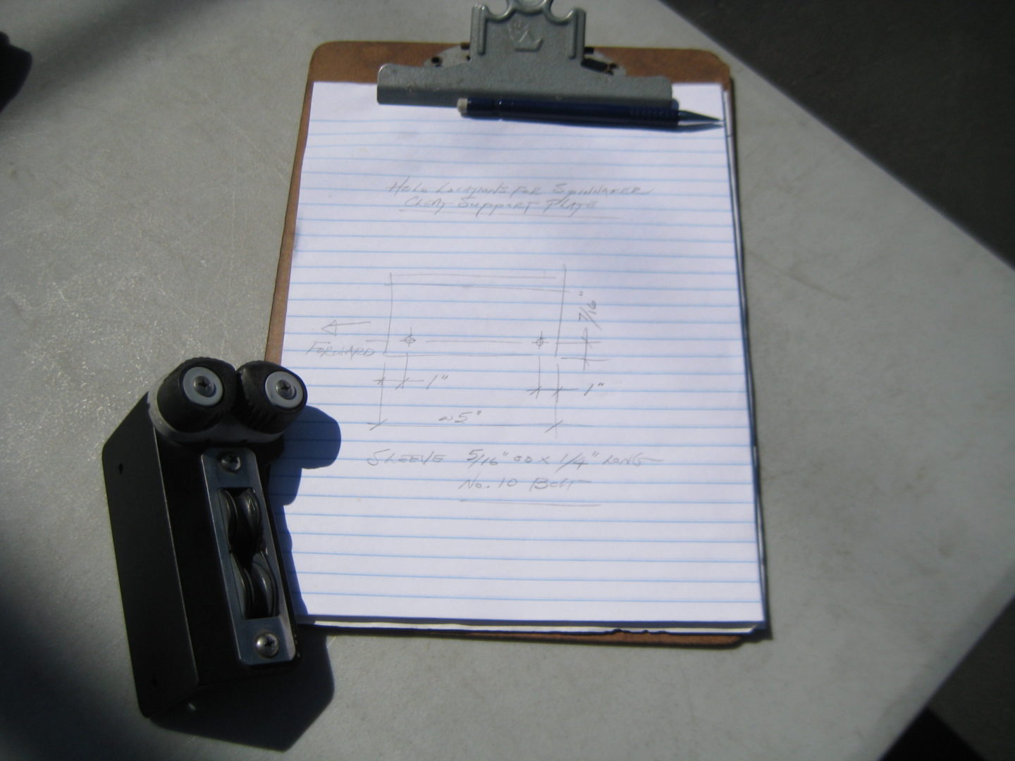 A clipboard with paper and a pencil on it.