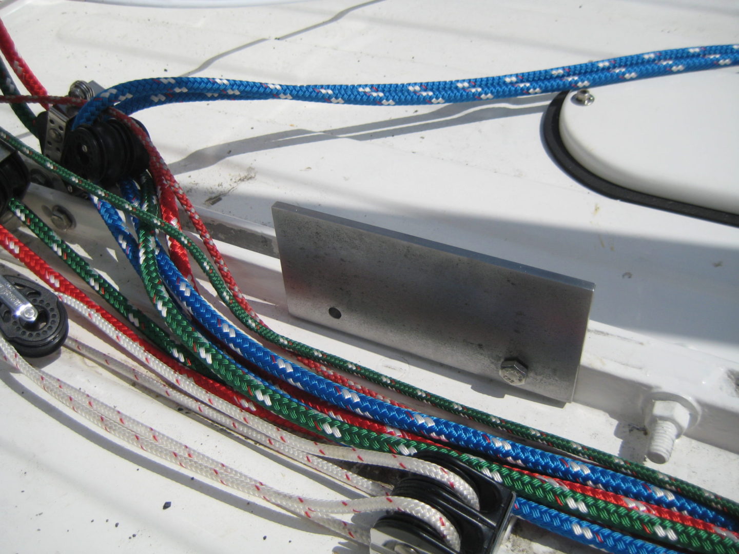 A close up of ropes on the side of a boat.