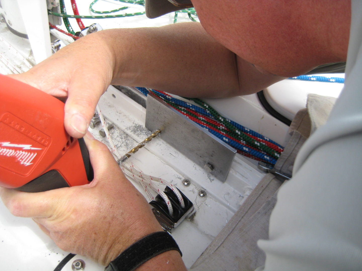 A man working on an electrical device.