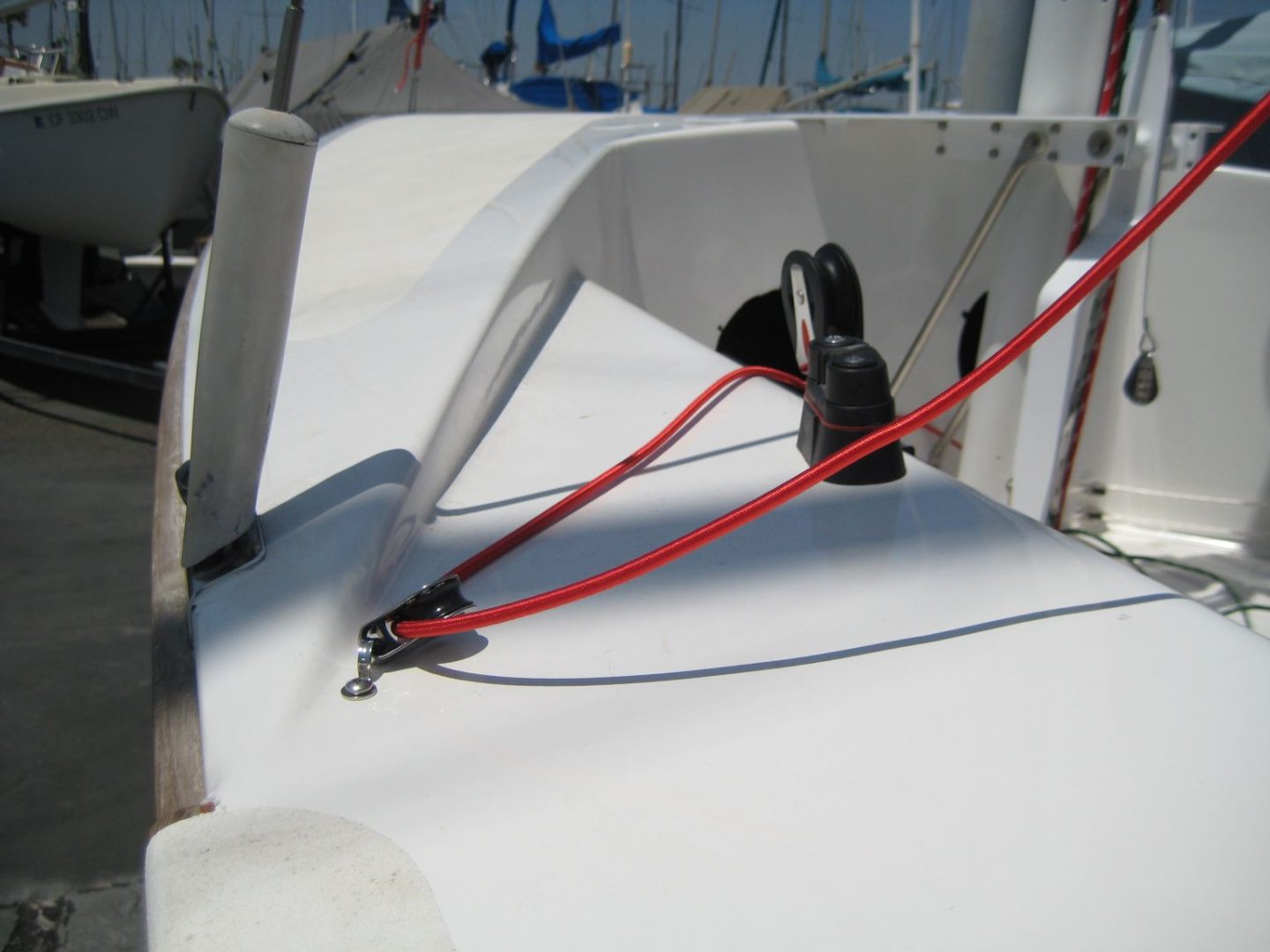 A boat is shown with red ropes attached to it.