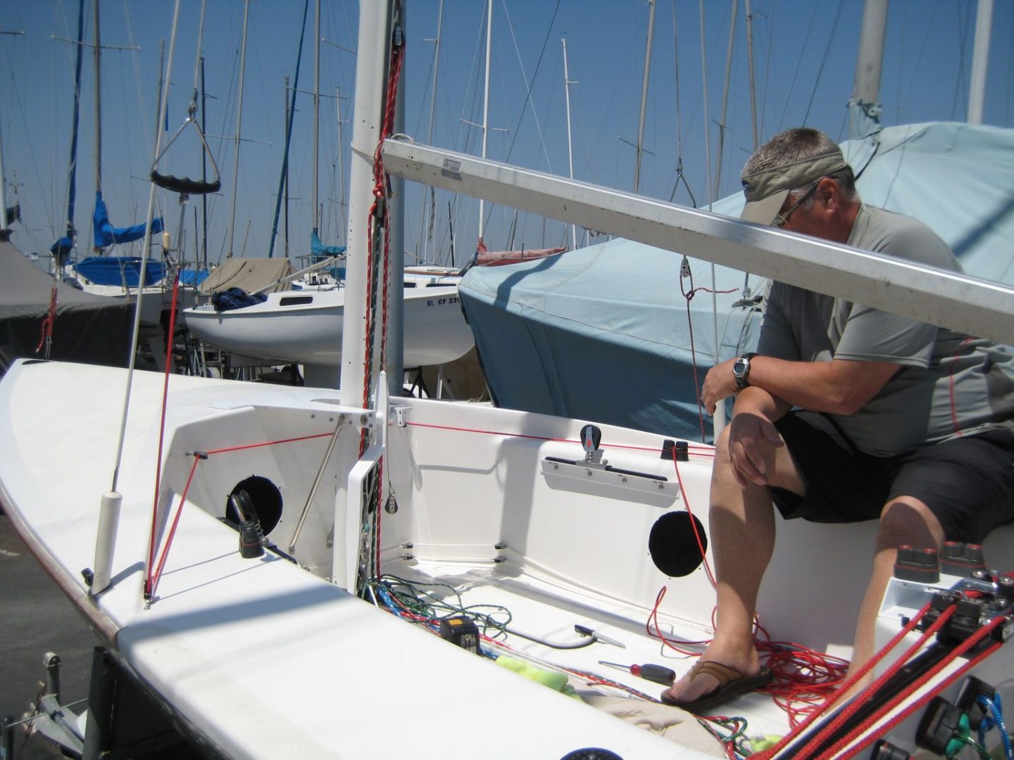 A man sitting on the side of a boat.