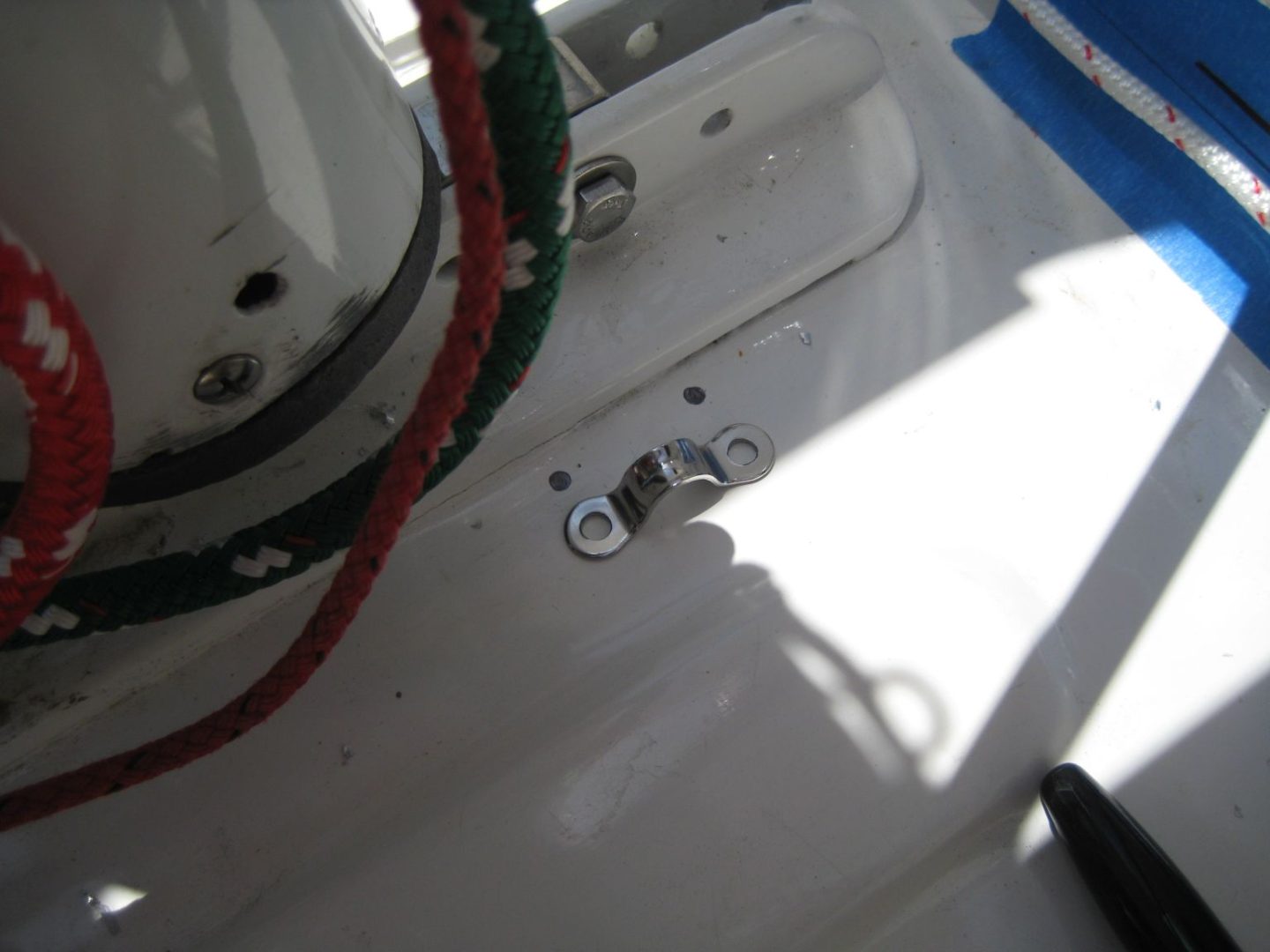 A close up of the side of a boat with some wires