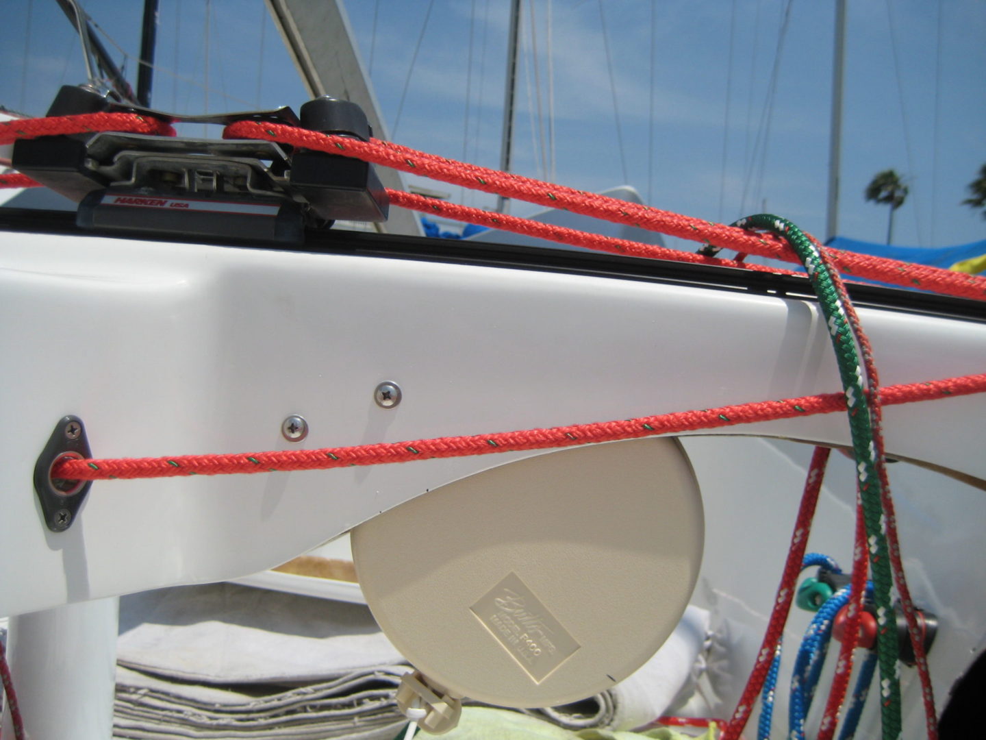 A boat with red ropes on it's deck.