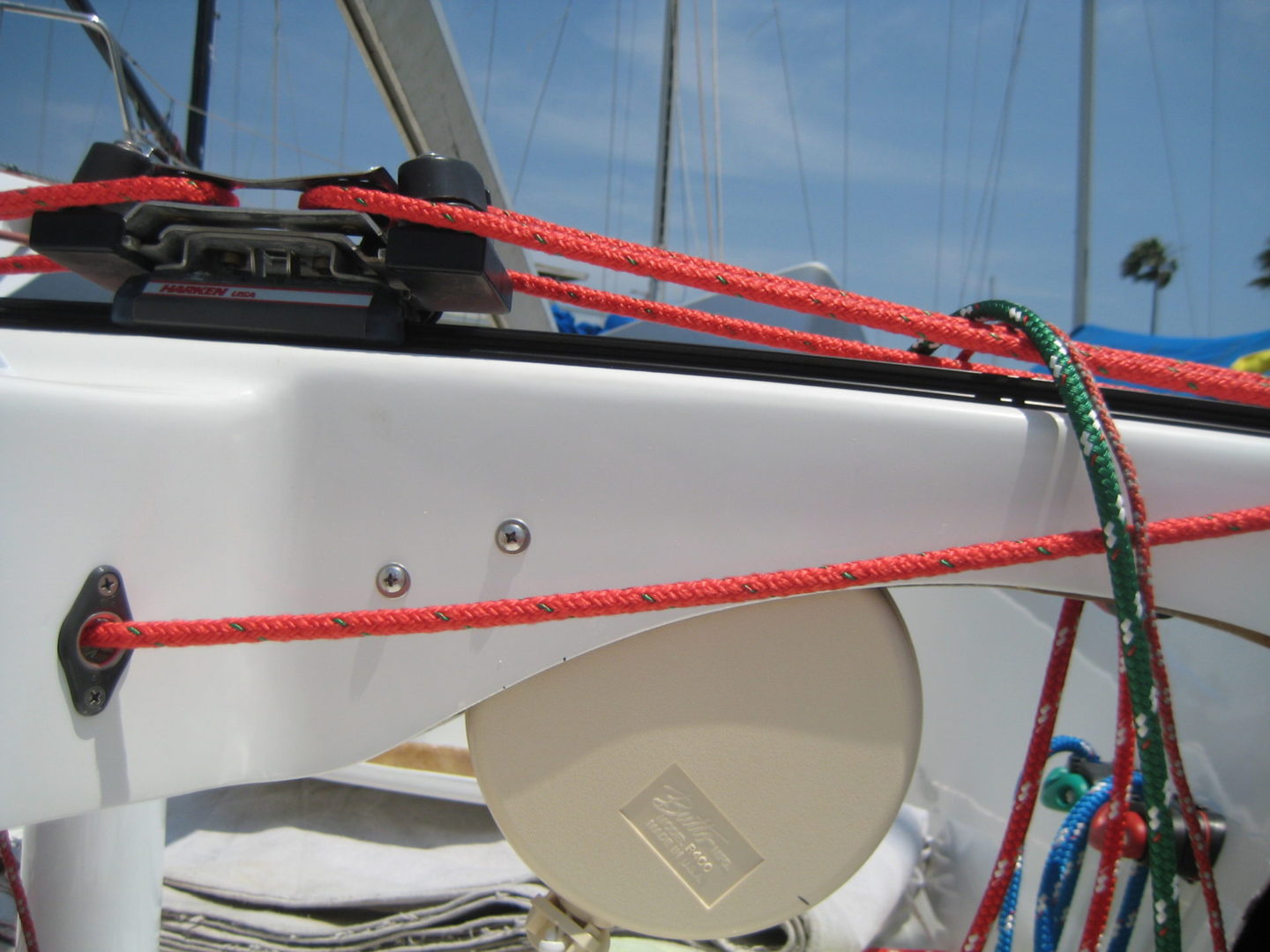 A boat with red ropes on it's deck.