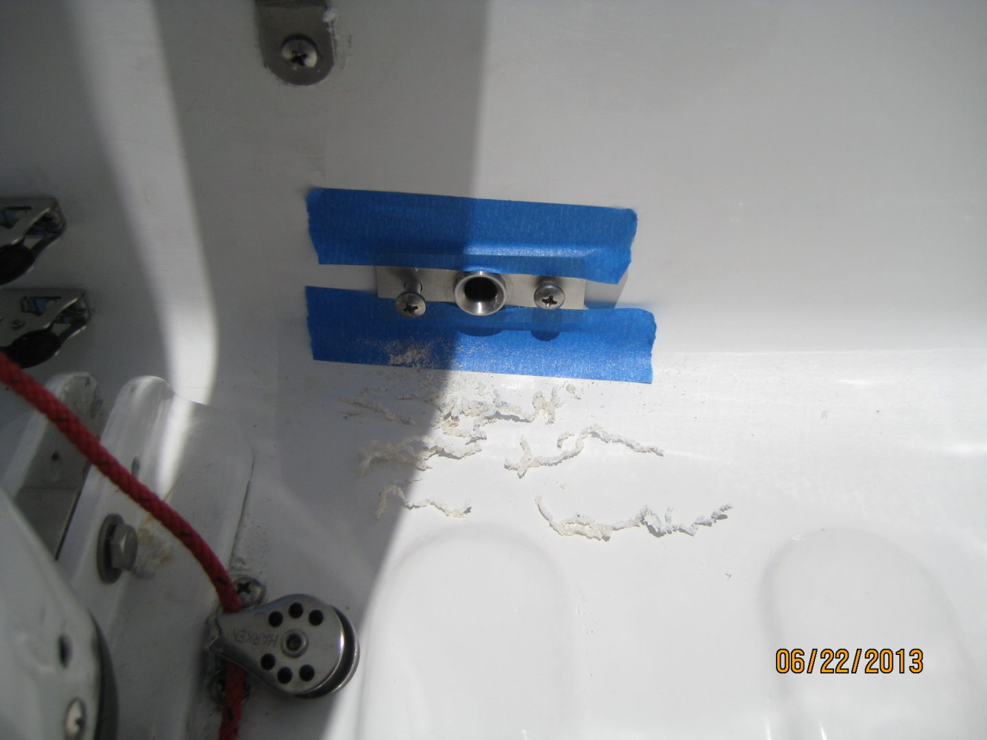 A bathroom with a blue strip on the ceiling