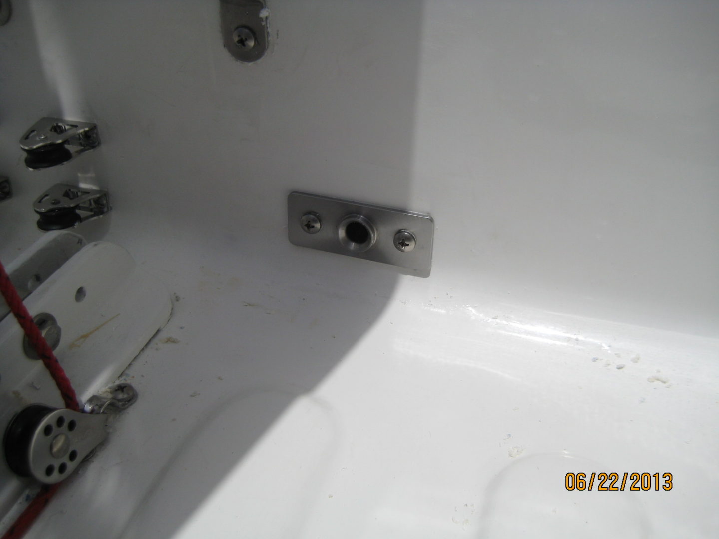 A bathroom with a white tub and a metal faucet.