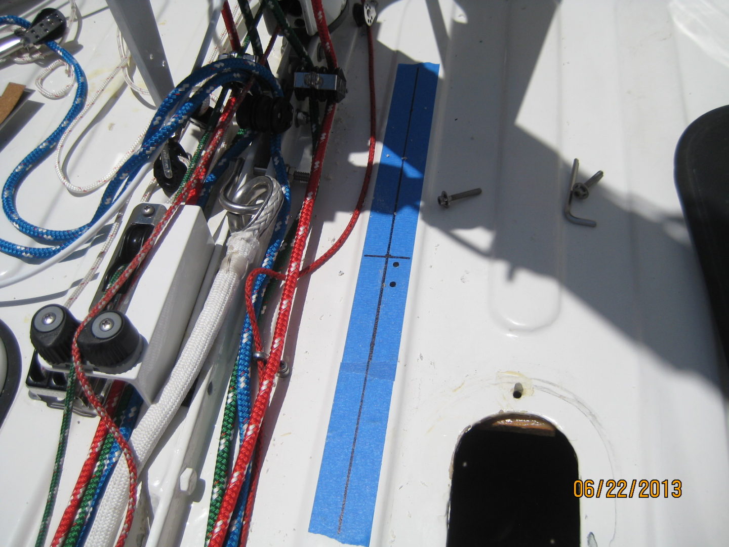 A close up of the side of a boat with wires.