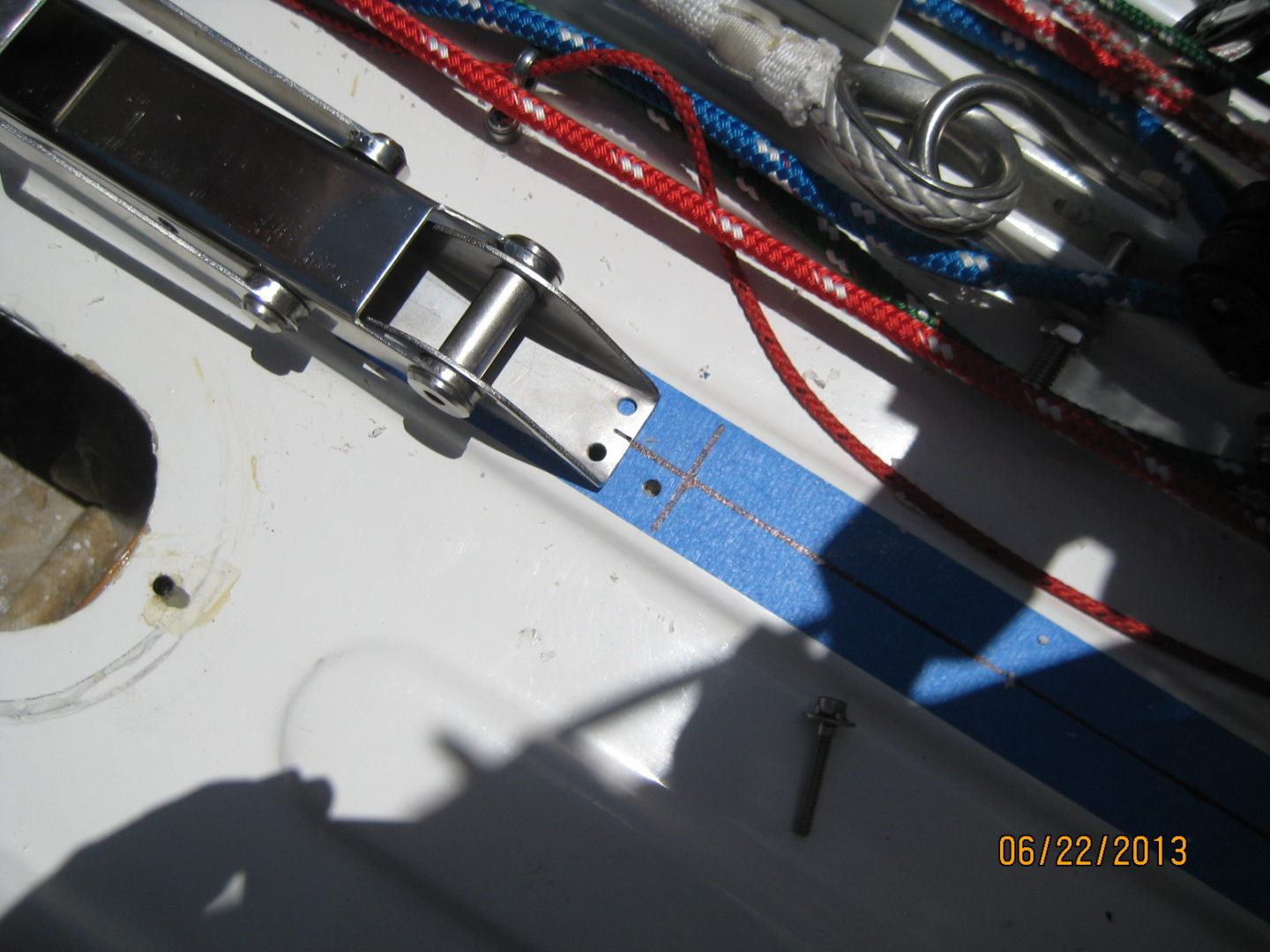 A close up of the side of a boat with wires.