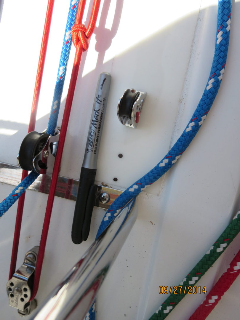 A close up of ropes on the side of a boat.