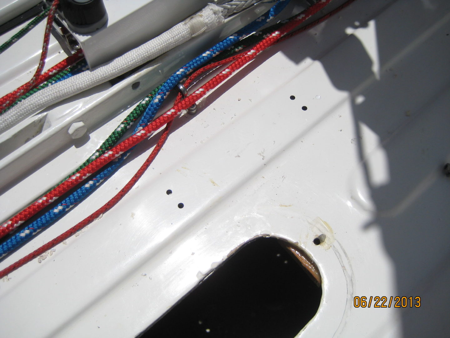 A close up of wires on the side of a boat.