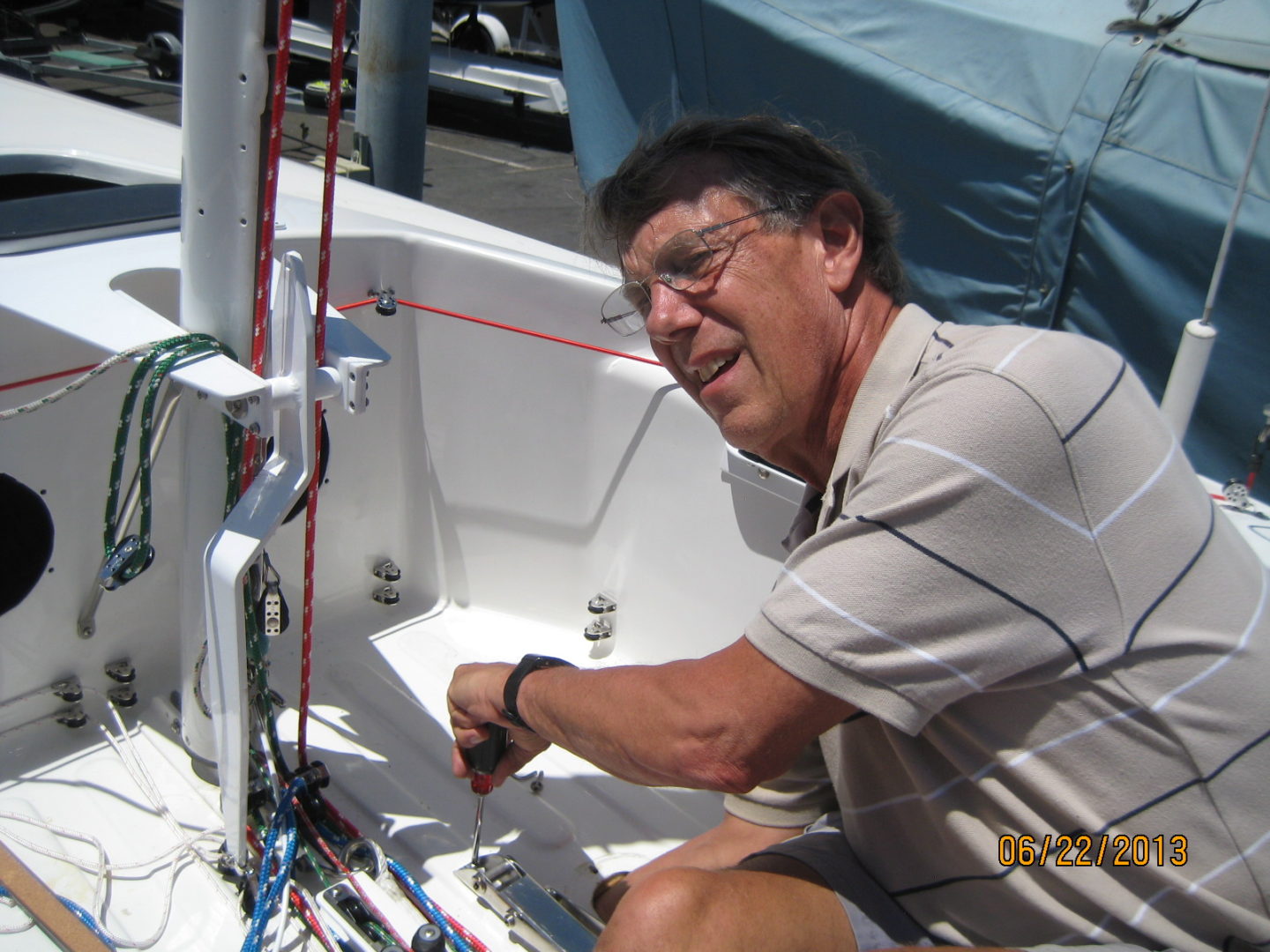 A man sitting on top of a boat.