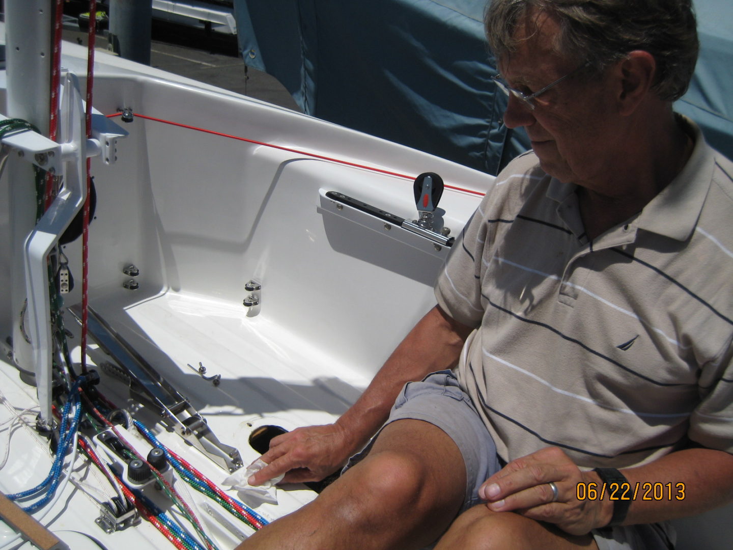 A man sitting on top of a boat.