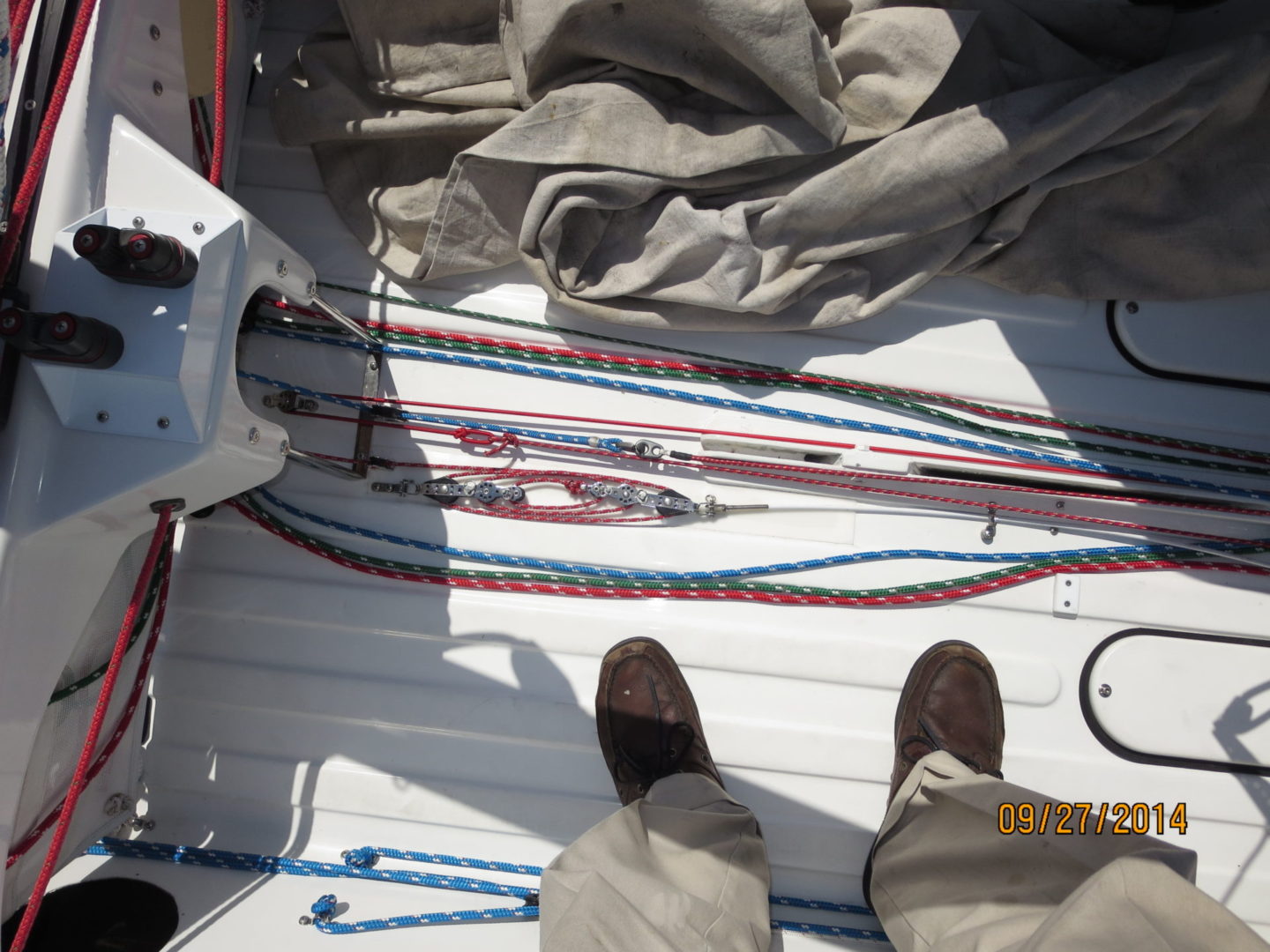 A person standing on the deck of a boat.