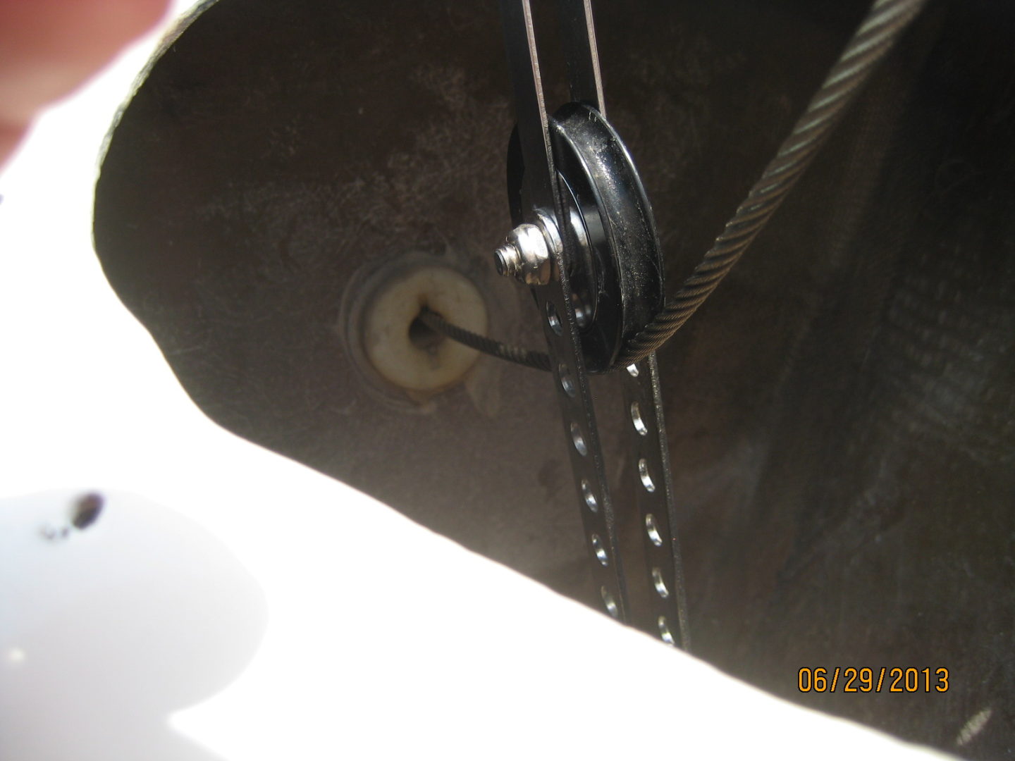 A close up of the pulley on a boat