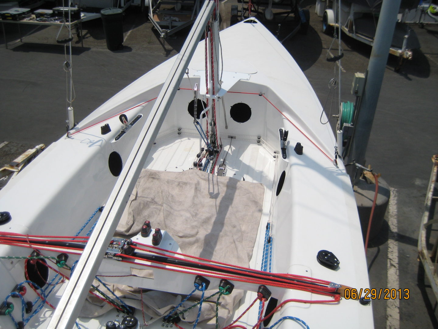 A boat with two sails and a red line on the front.