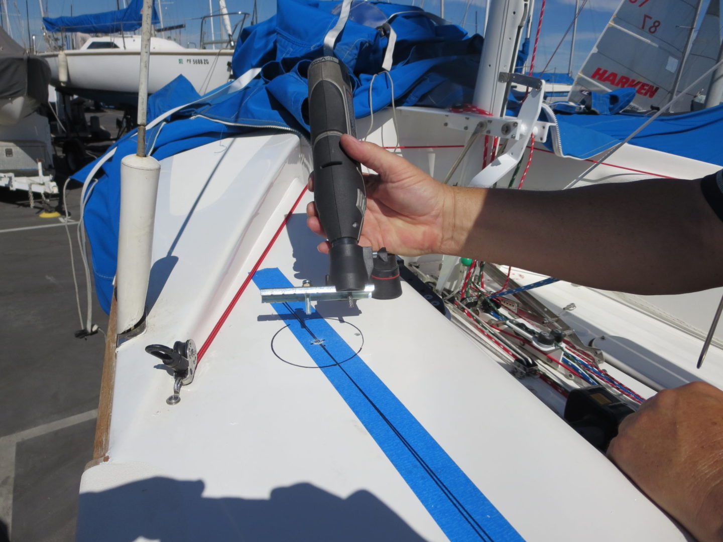 A person holding onto the side of a boat