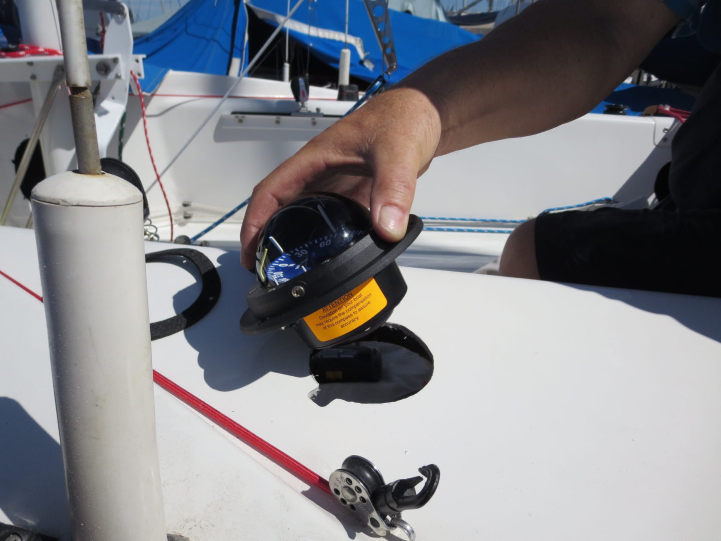 A person holding onto the side of a boat