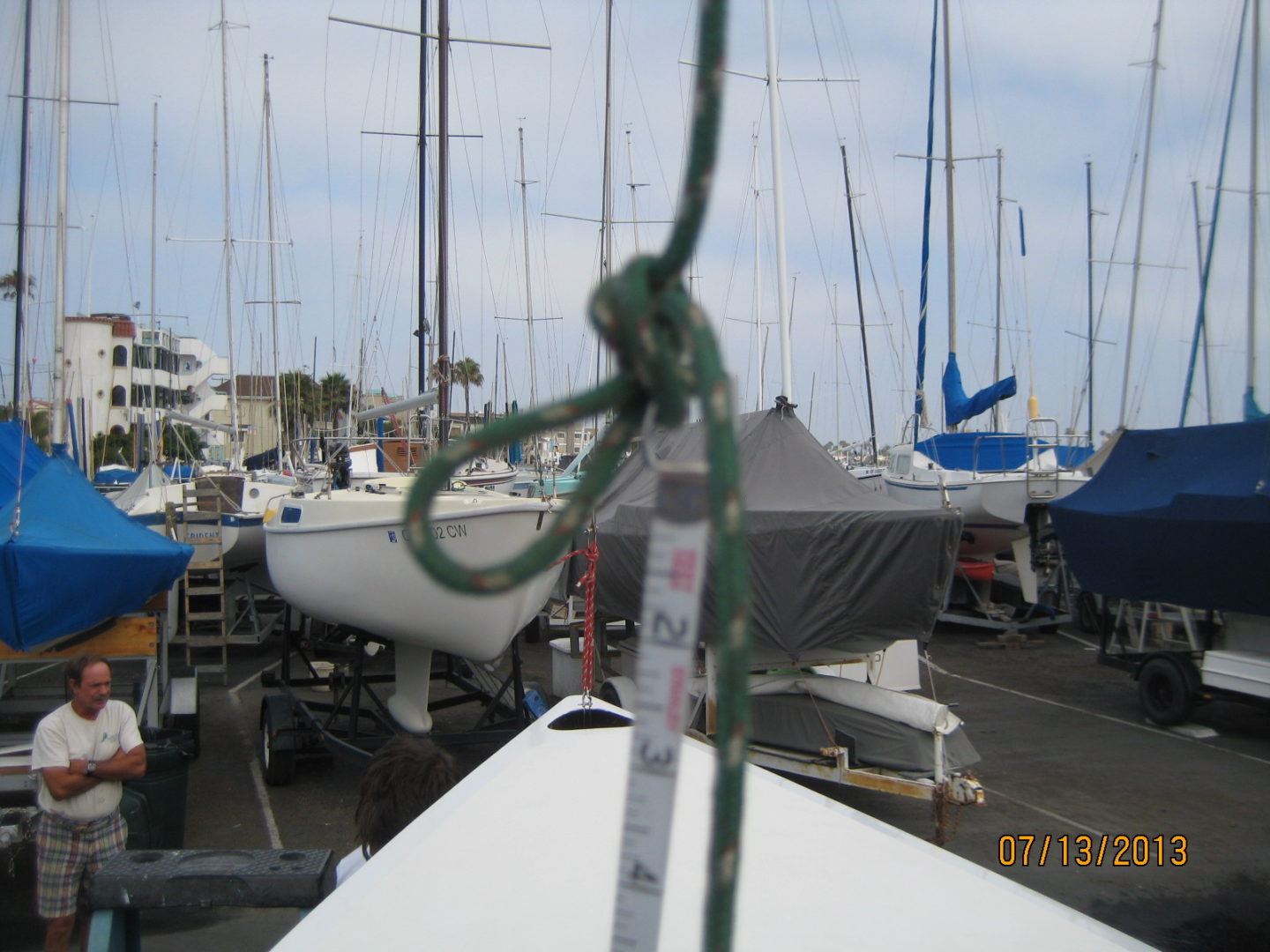 A boat is tied to the side of a dock.