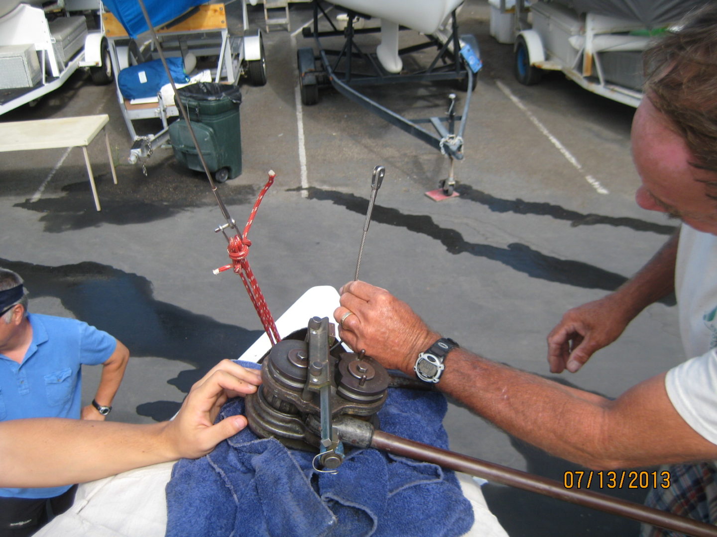 A man is holding two different types of tools.