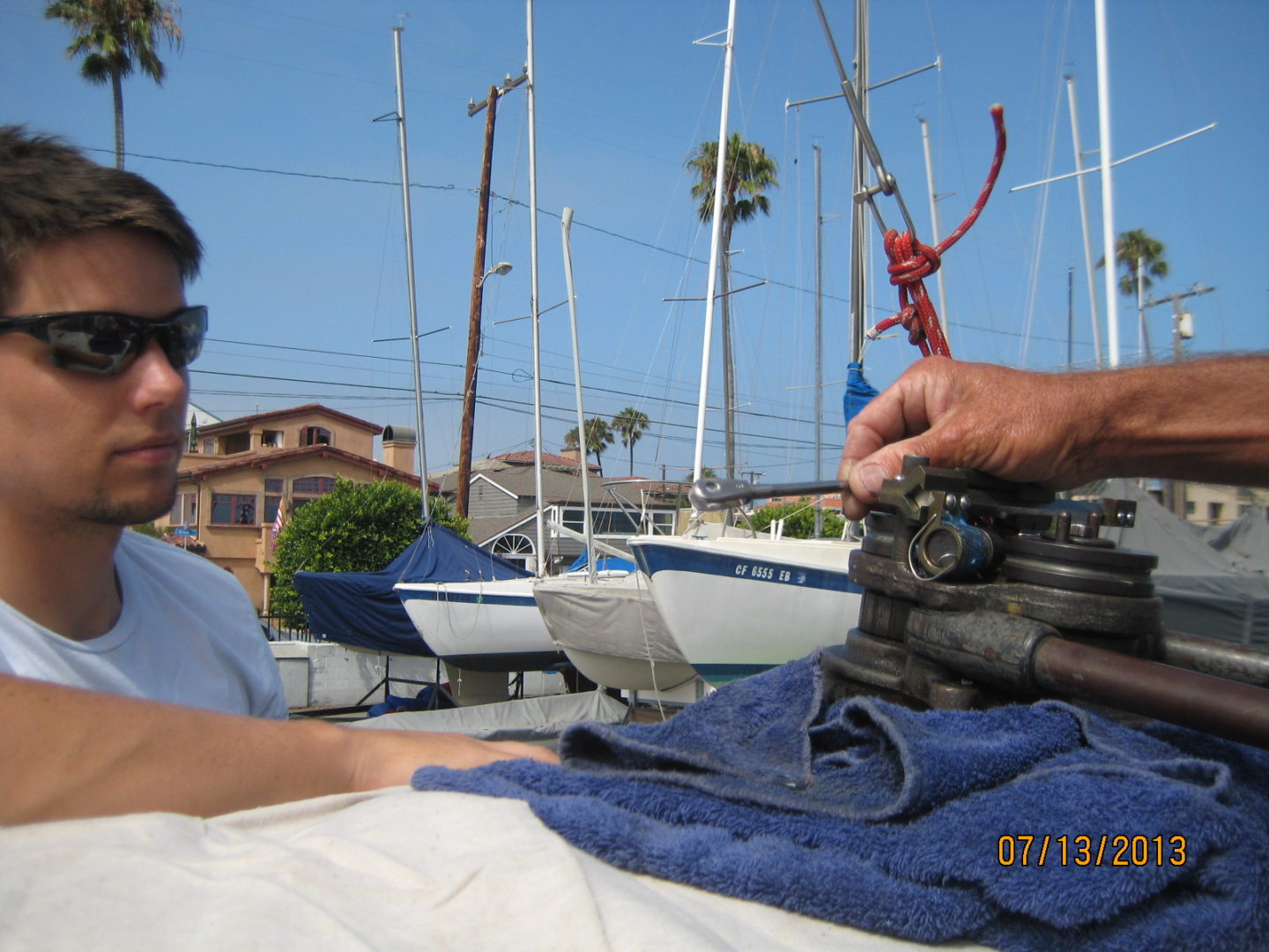 A man sitting on top of a boat.