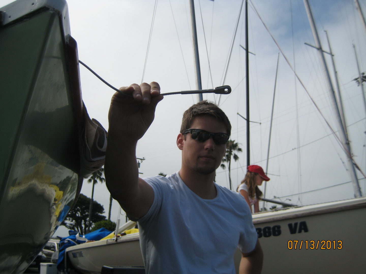 A man holding onto the handle of a boat