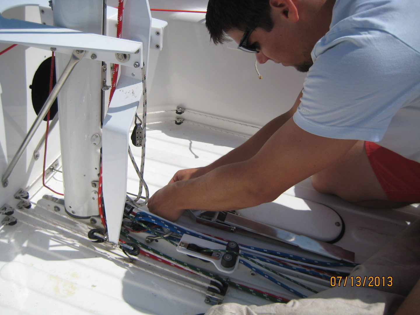 A man working on the side of a boat.