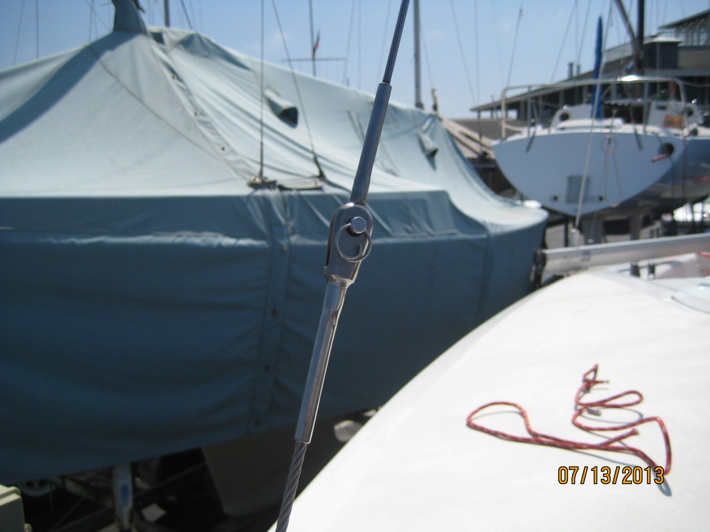 A boat is docked in the water and has a rope tied to it.