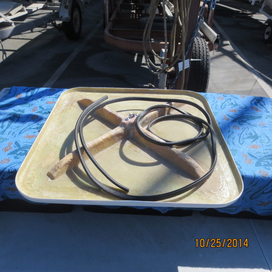 A tray with a wooden handle and some metal wires