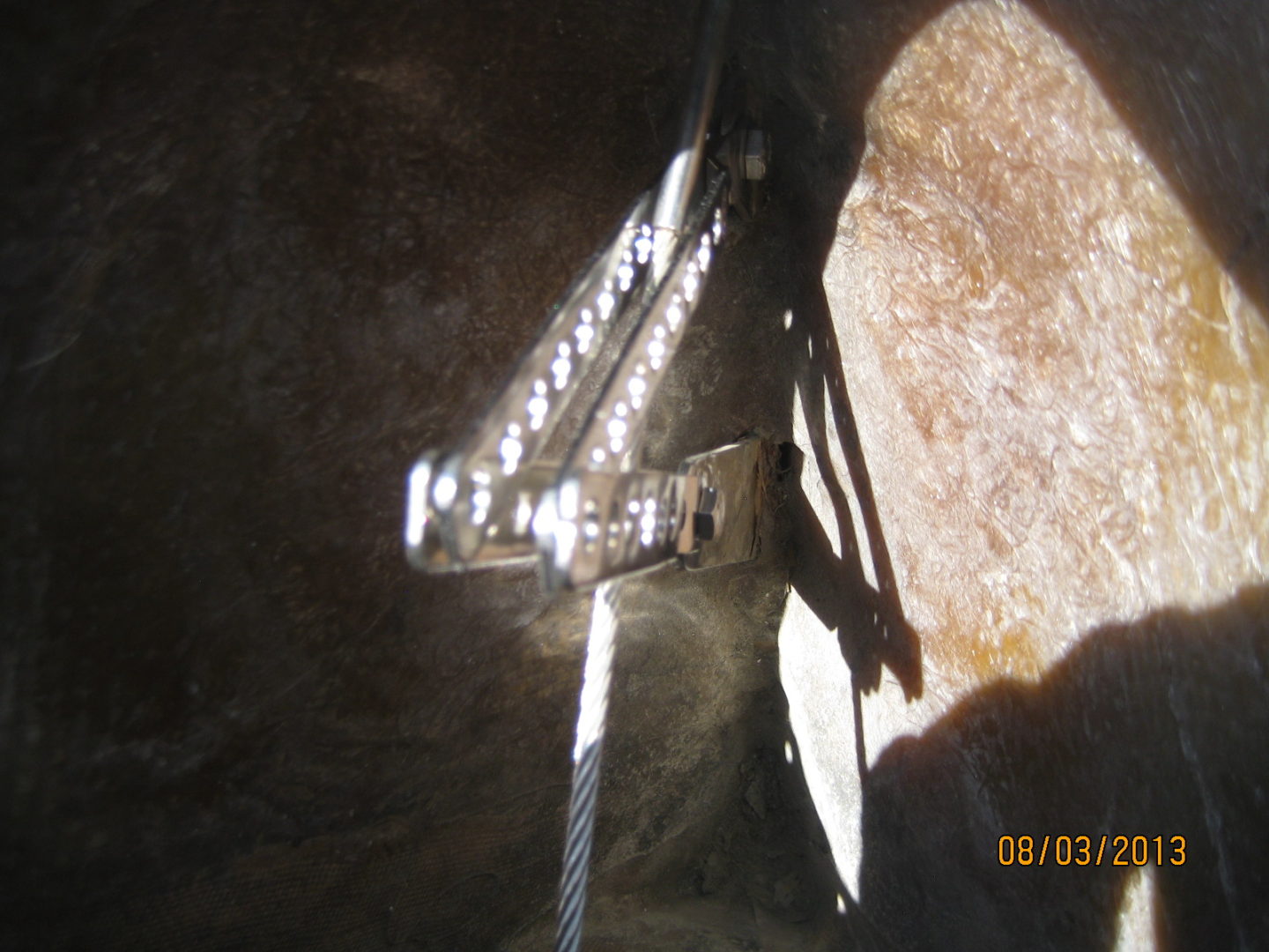 A light that is on in the middle of a cave.