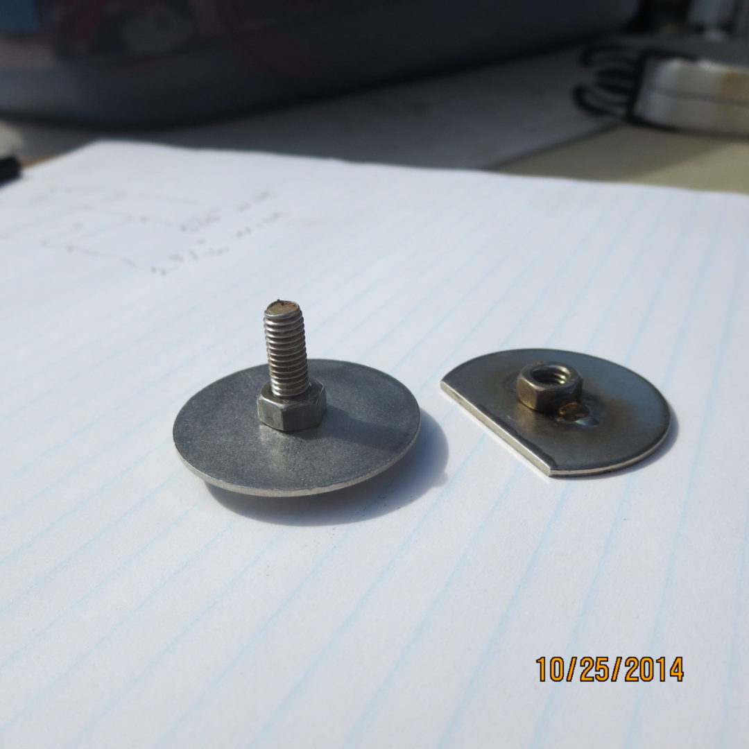 A pair of metal discs with one missing the center.