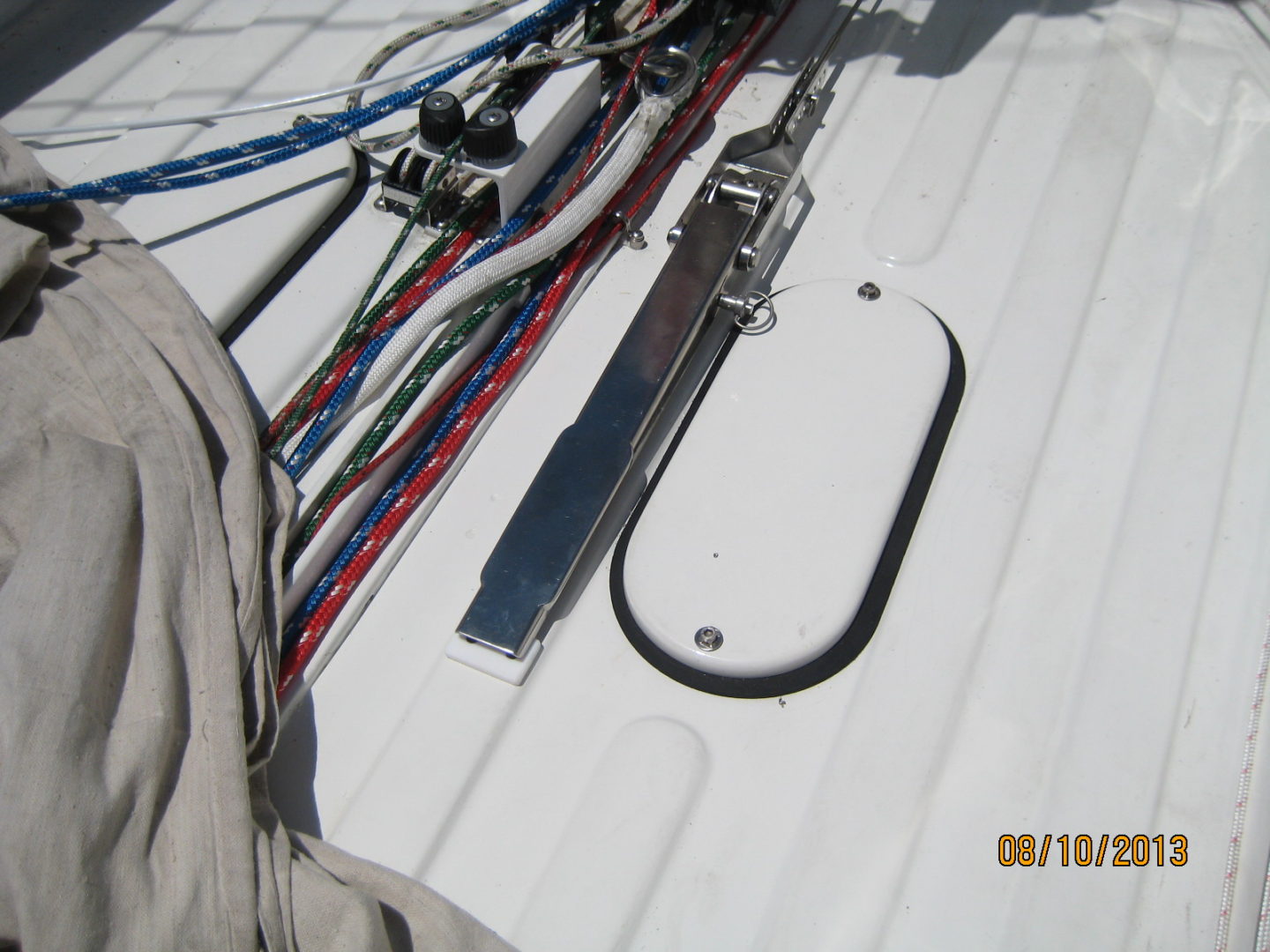 A bunch of different types of skis on the deck.