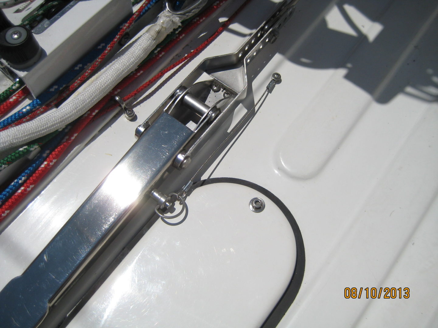 A close up of the side of a boat with wires attached to it.