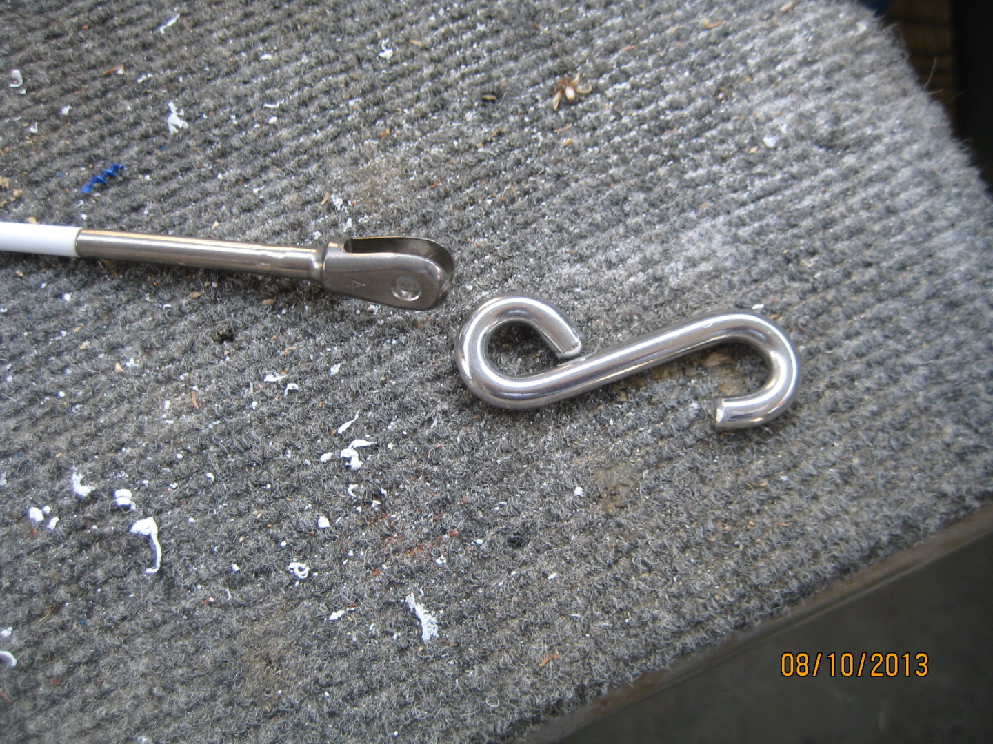 A close up of some metal hooks on the ground