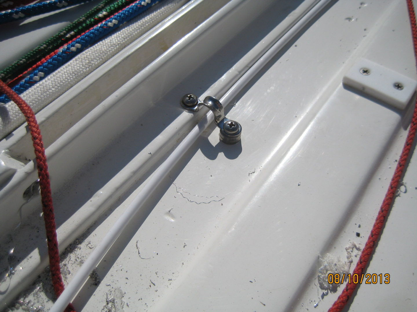 A close up of some white pipes on top of a building.