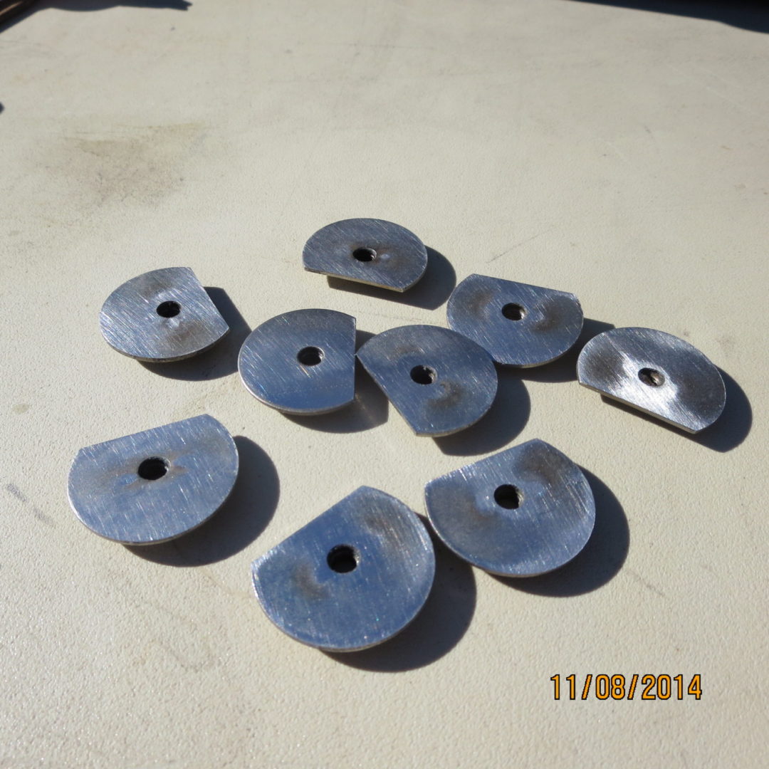 A group of metal discs sitting on top of a table.