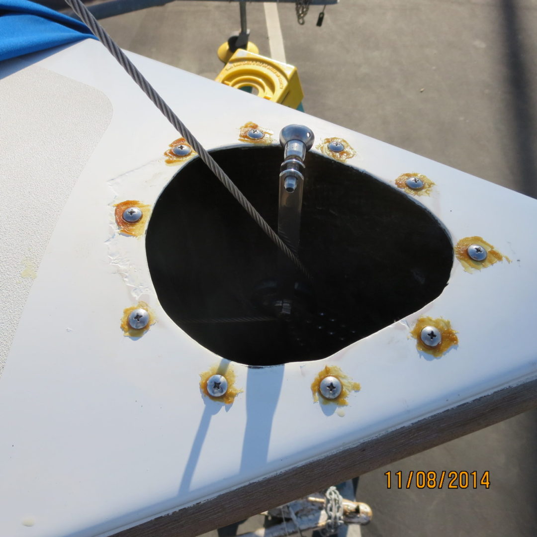 A close up of the hole in the wing of an airplane.