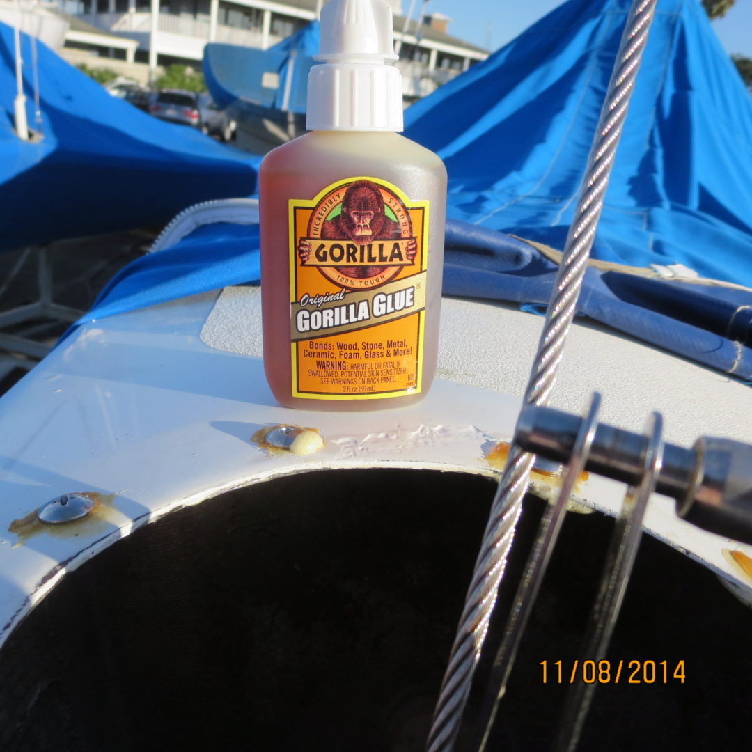 A bottle of oil sitting on top of a boat.