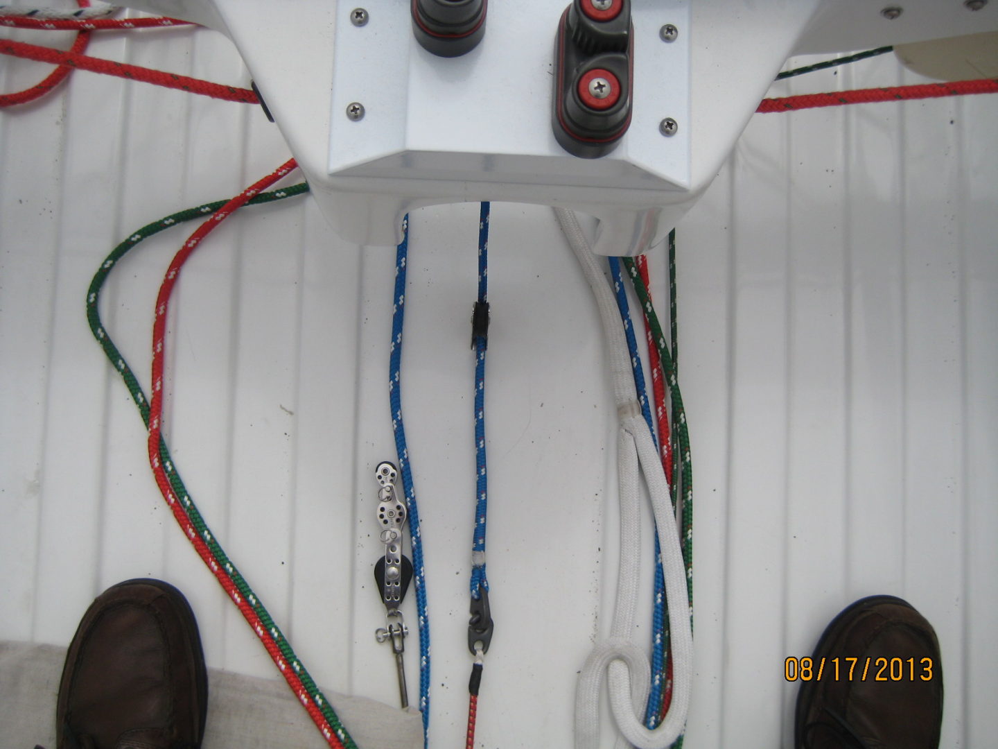 A close up of wires and cables on the side of a boat.