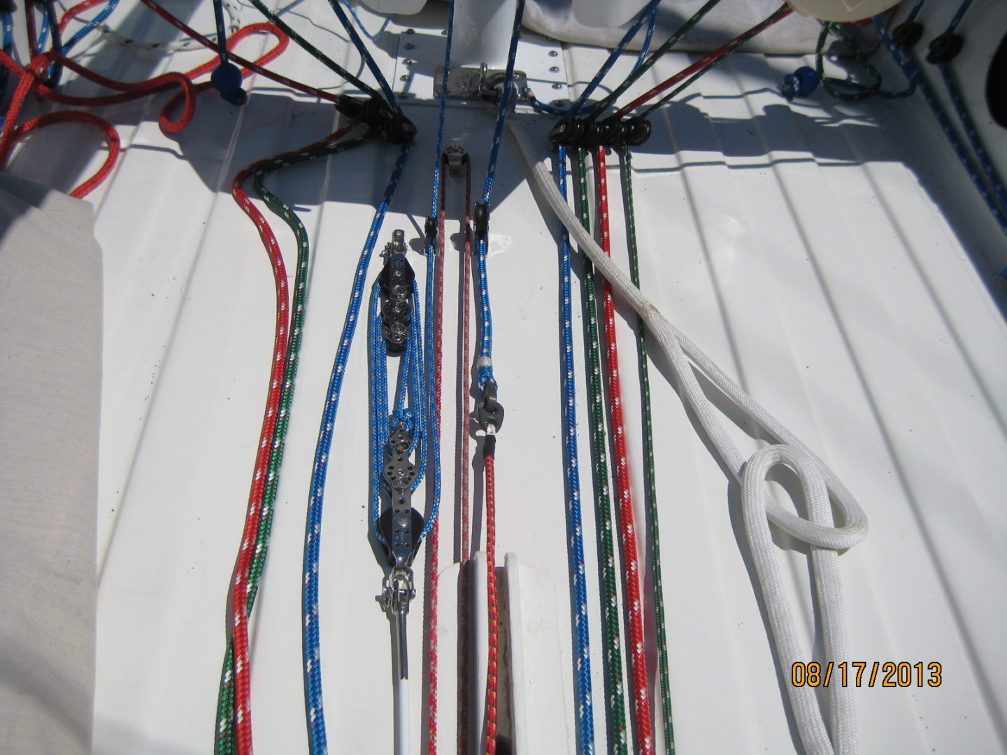 A bunch of ropes are tied to the side of a boat.