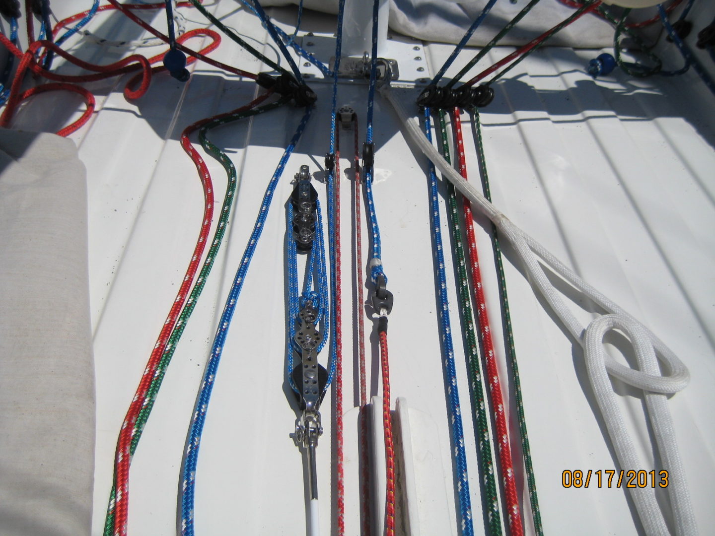 A bunch of ropes are tied to the side of a boat.