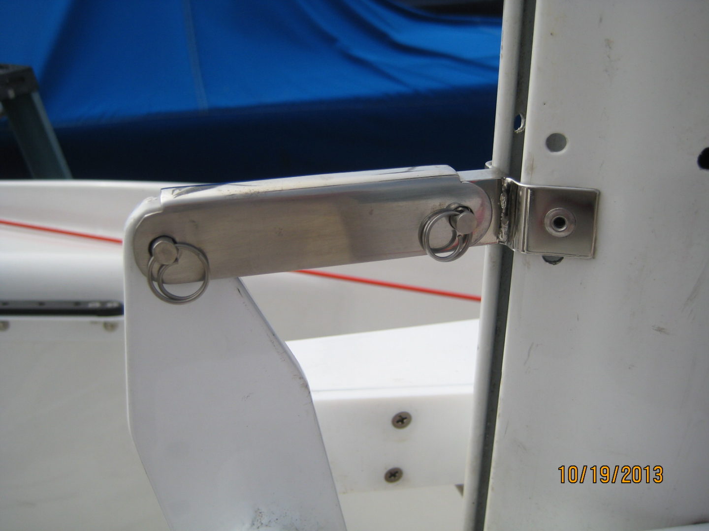 A close up of the door handle on a boat.