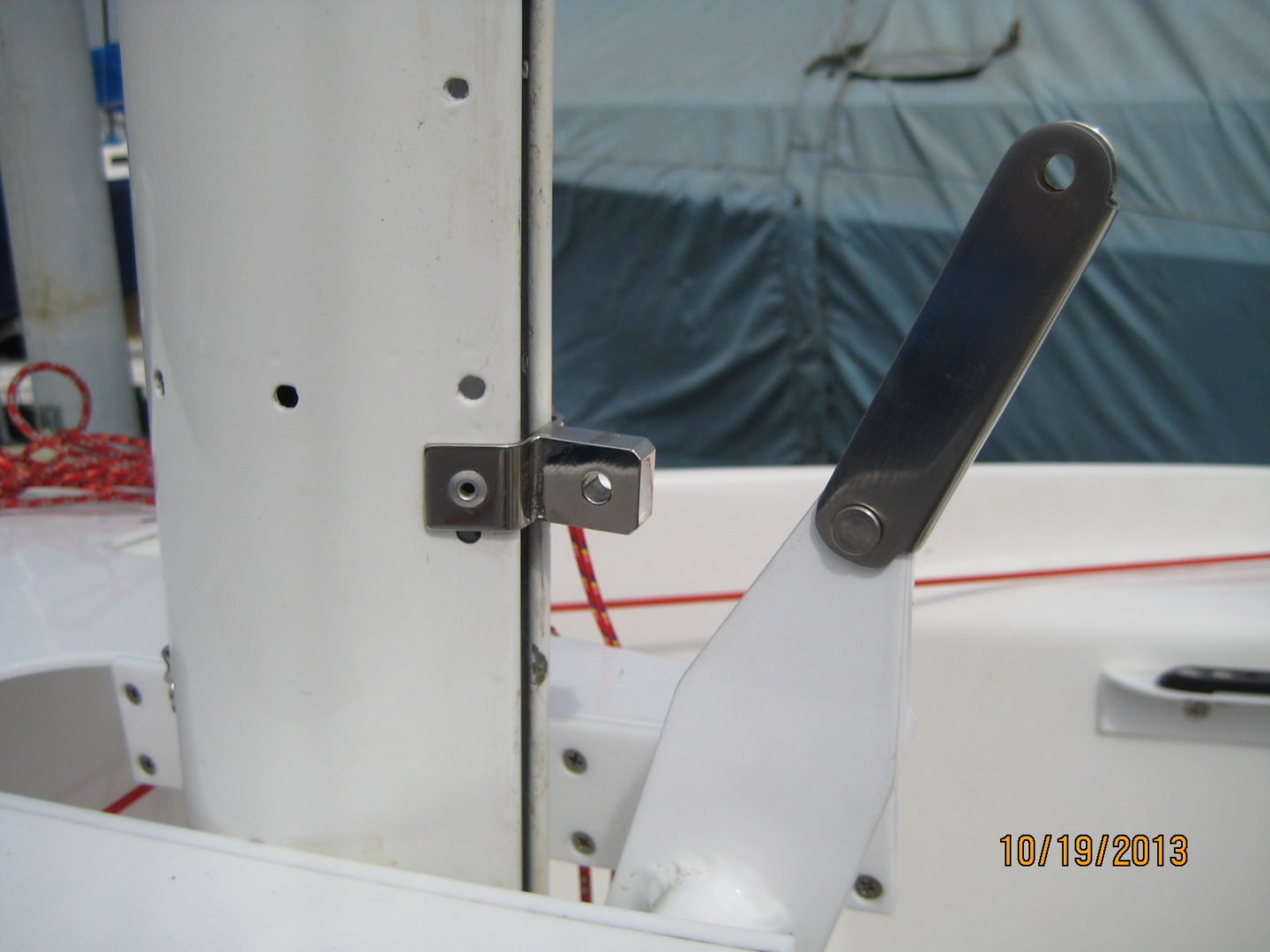 A close up of the door handle on a boat.