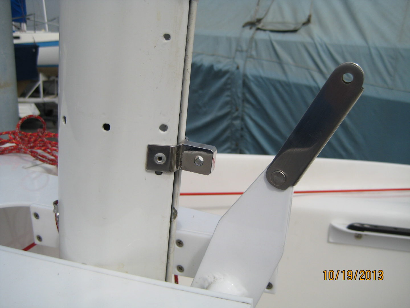 A knife is sticking out of the side of a boat.