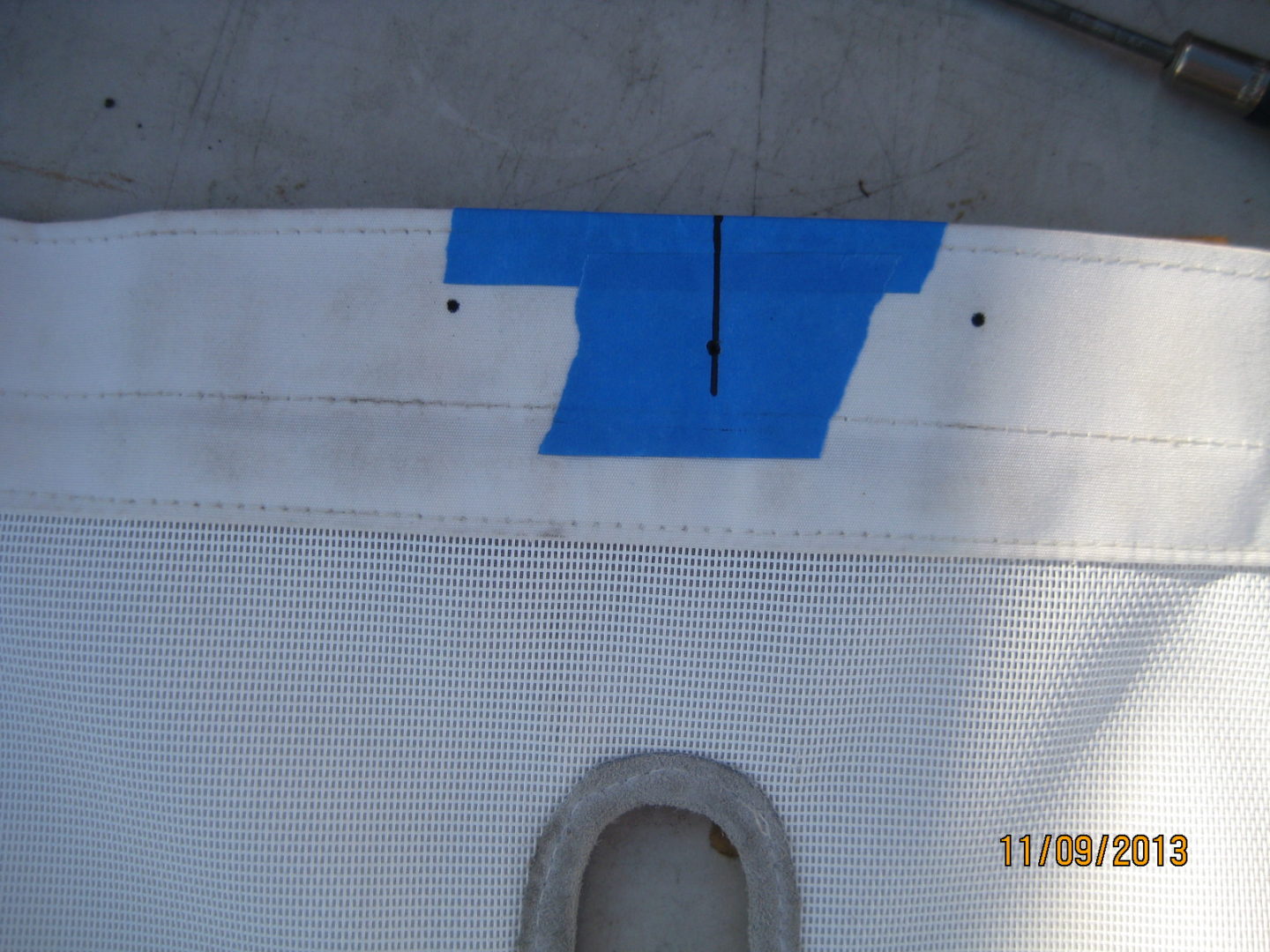 A blue stripe is on the side of an airplane.