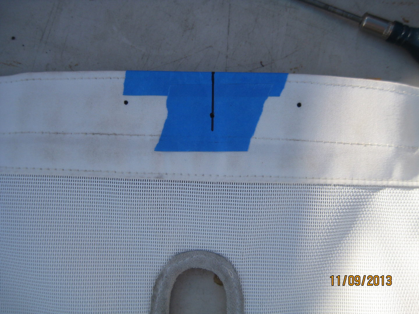 A blue piece of paper on the side of a boat.