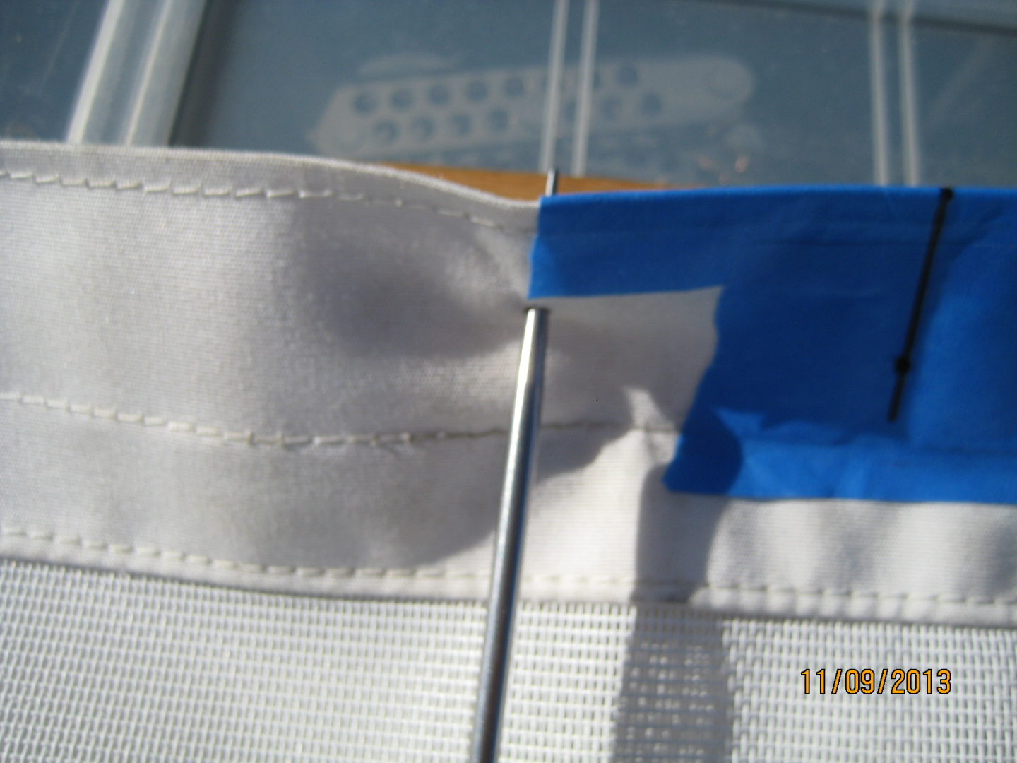 A close up of the blue and white ribbon