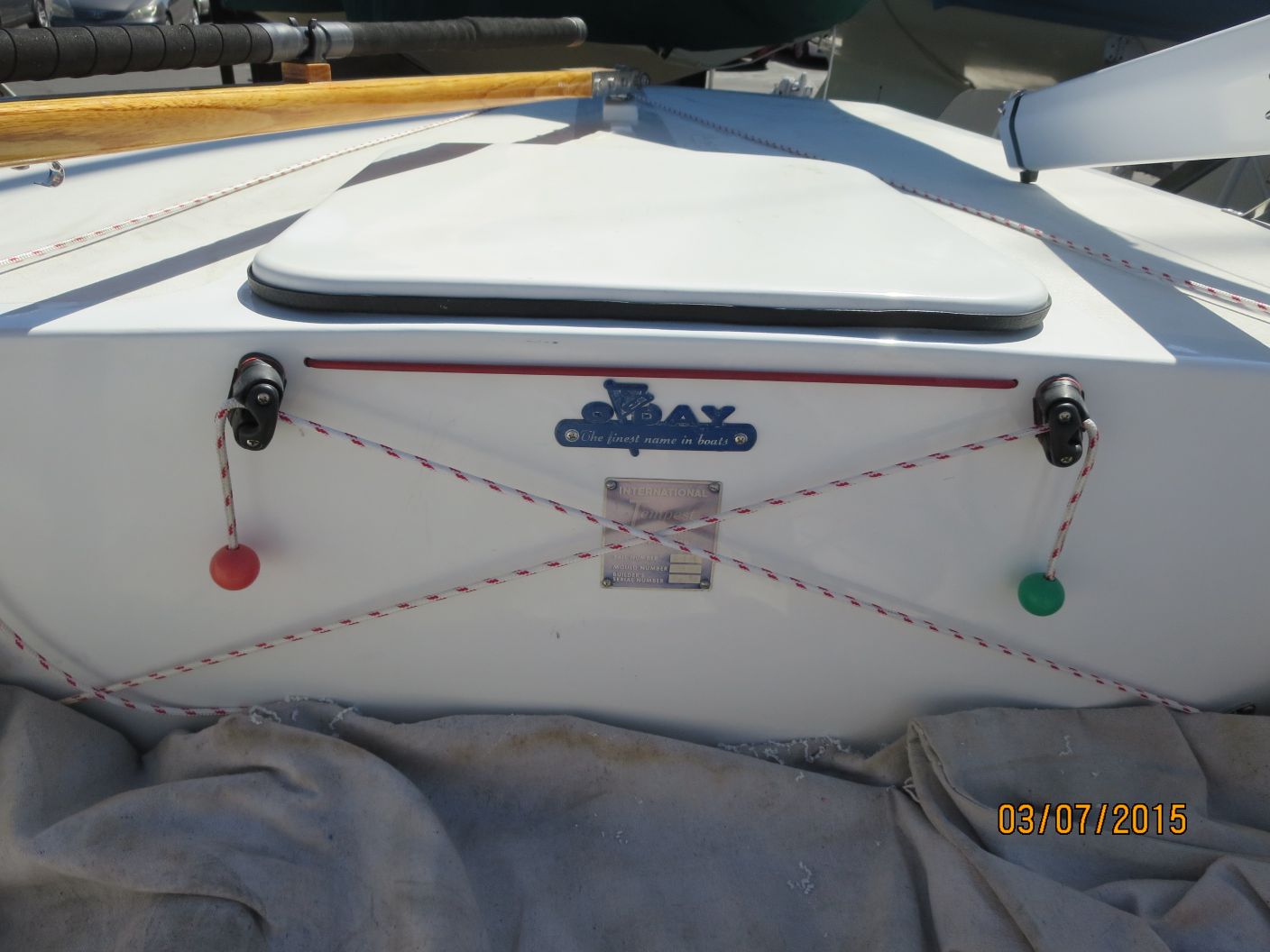 A boat with two red and green buttons on the front.