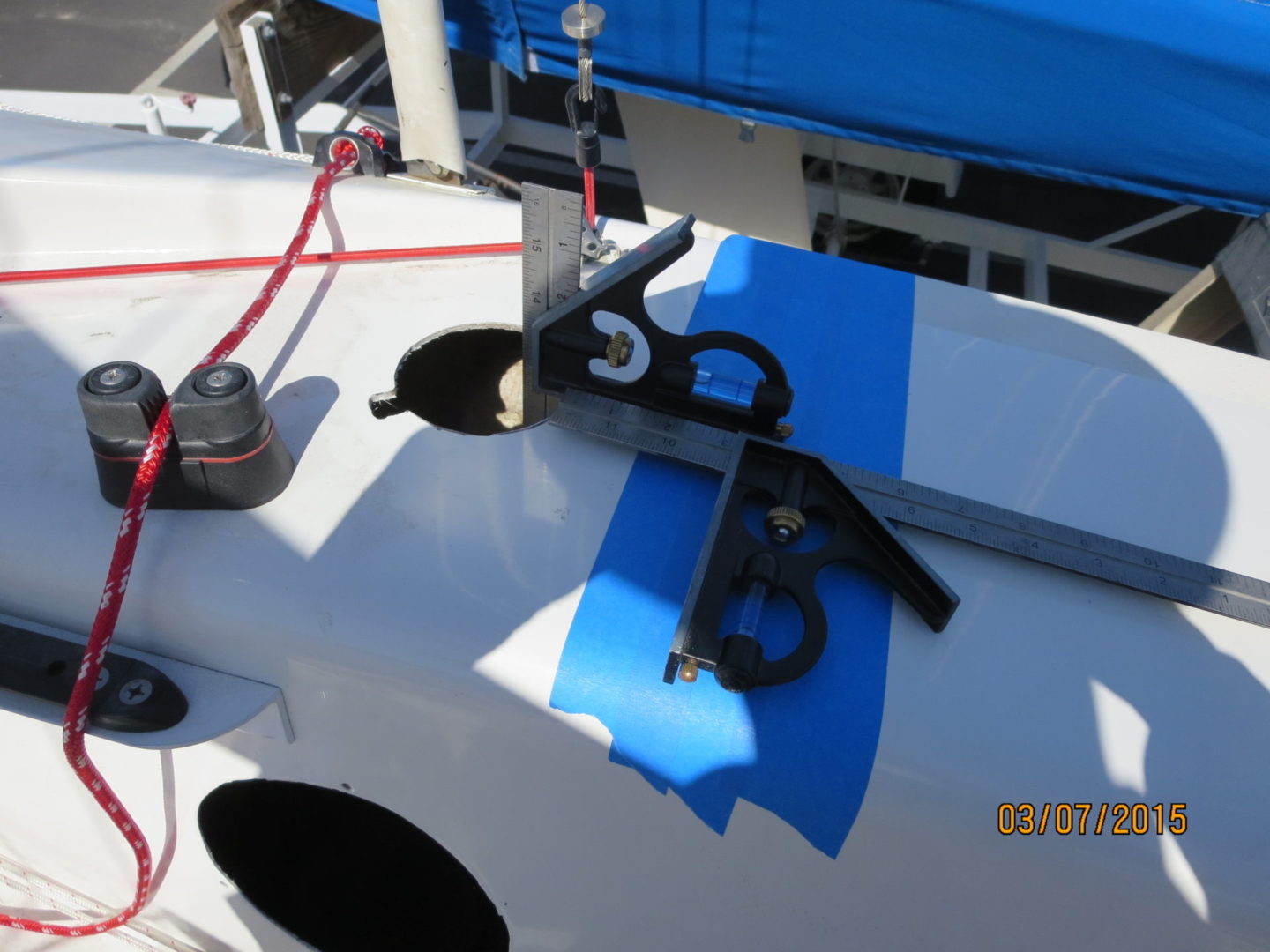 A pair of scissors on the side of a boat.